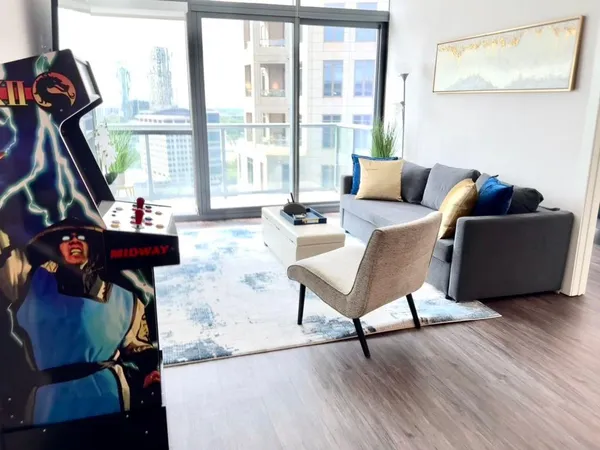 a living room with furniture and a window