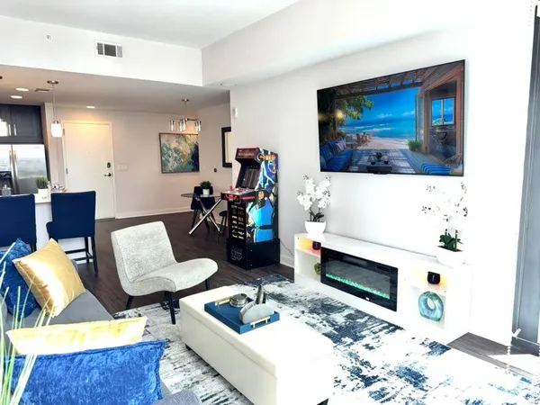 a living room with furniture and a large window