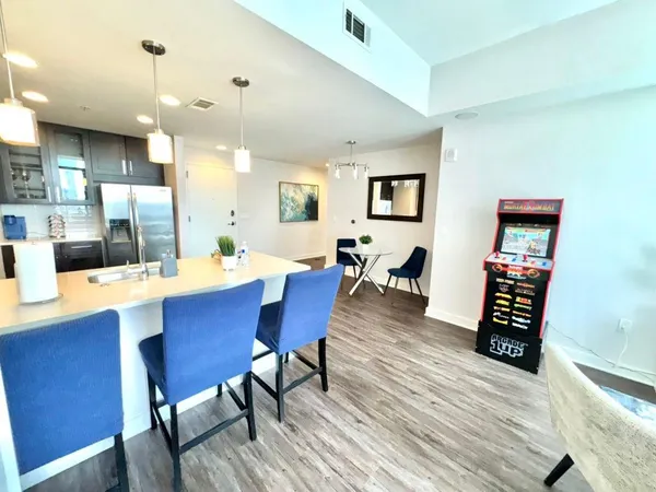a view of a livingroom with furniture and wooden floor