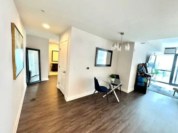 a bathroom with a sink vanity mirror and toilet