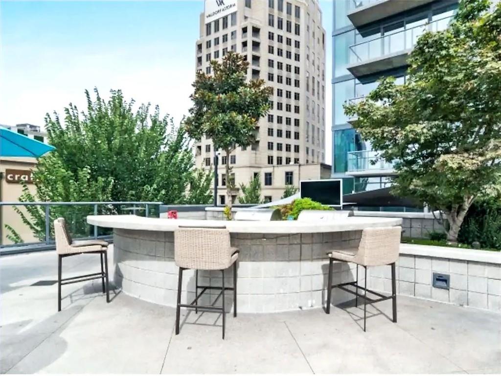 3382 Peachtree Road Northeast, Unit S08 Atlanta, GA 30326 - Photo 41 of 52 a view of a patio with a table and chairs
