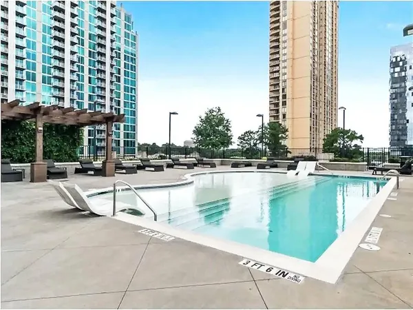 a view of swimming pool with outdoor seating