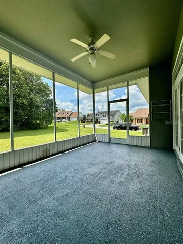 a view of an empty room with a large window