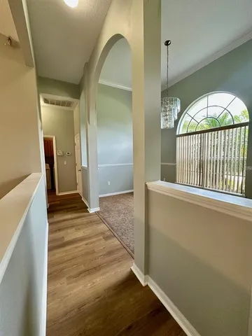 a view of an entryway with wooden floor