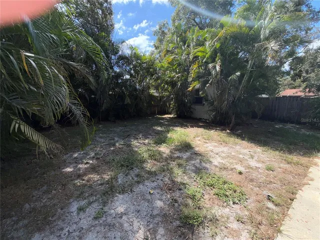 a view of backyard with green space