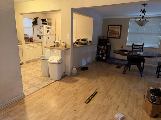 a bathroom with a sink a toilet a mirror and shower