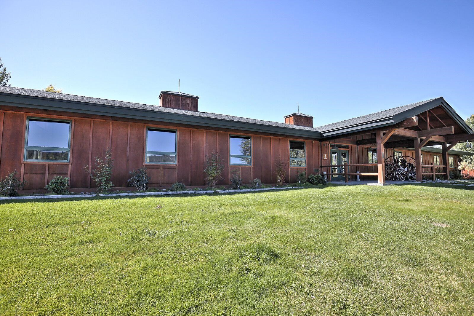 134 Quail View Circle Clio, CA 96106 - Photo 42 of 49 a front view of a house with a garden and porch