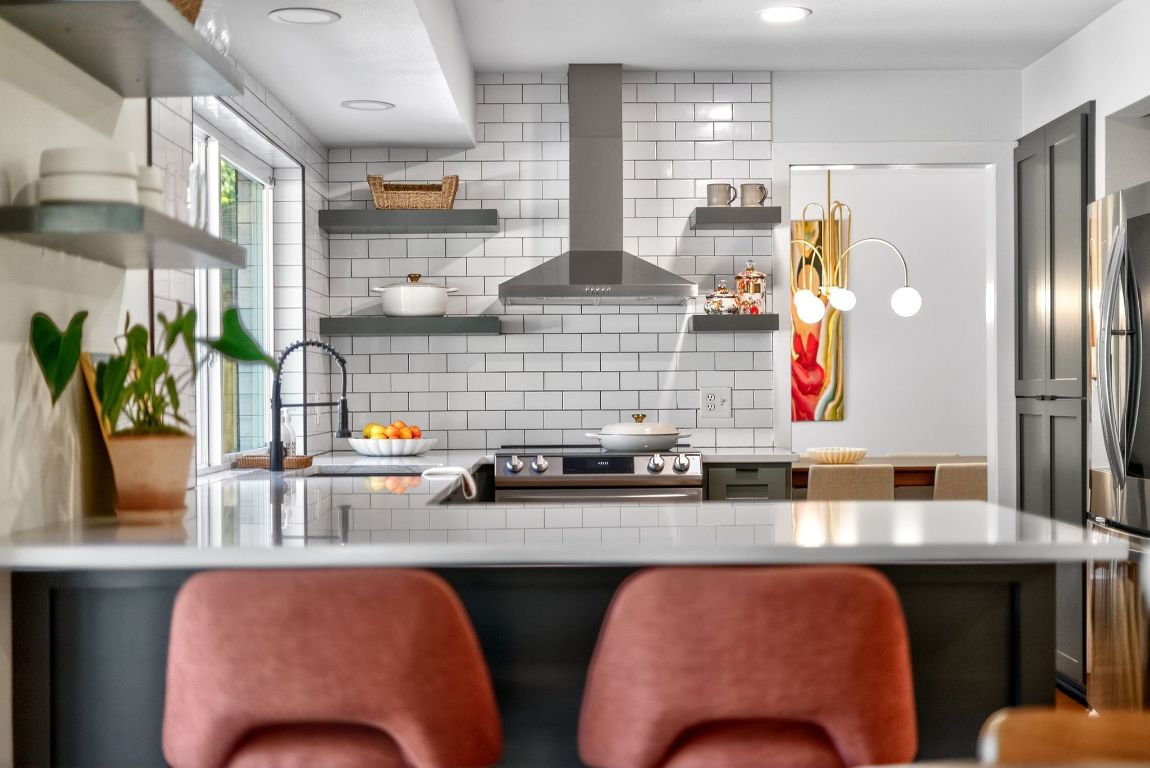 2502 Comburg Castle Way Austin, TX 78748 - Photo 3 of 35 a kitchen with stainless steel appliances a sink and a refrigerator