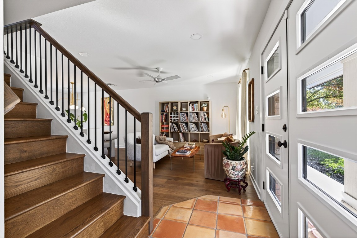 2502 Comburg Castle Way Austin, TX 78748 - Photo 5 of 35 a view of staircase with lots of frames on wall and a dining table