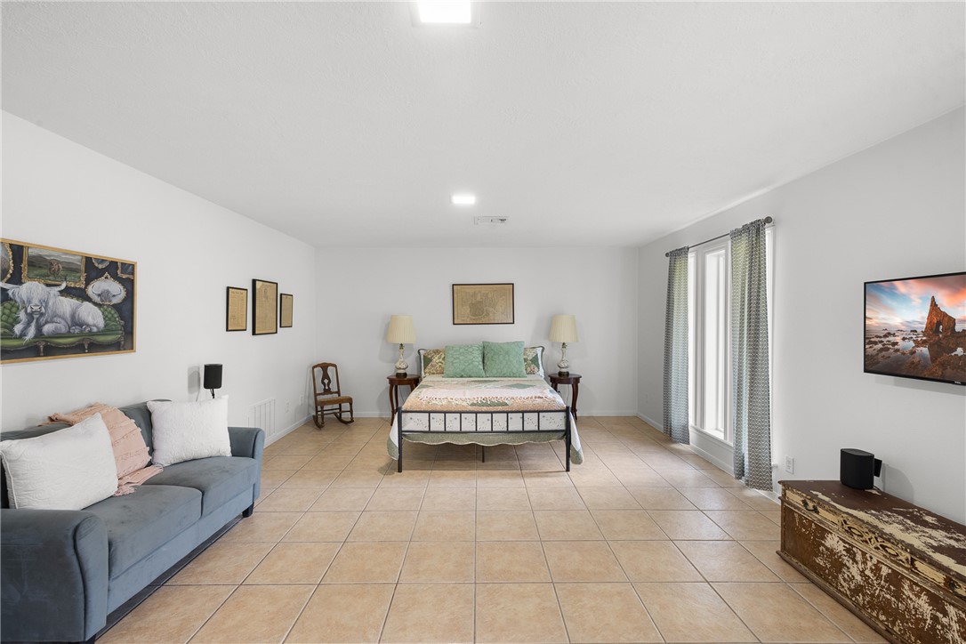 871 Cazey Loop Franklin, TX 77856 - Photo 23 of 42 a living room with furniture and a flat screen tv