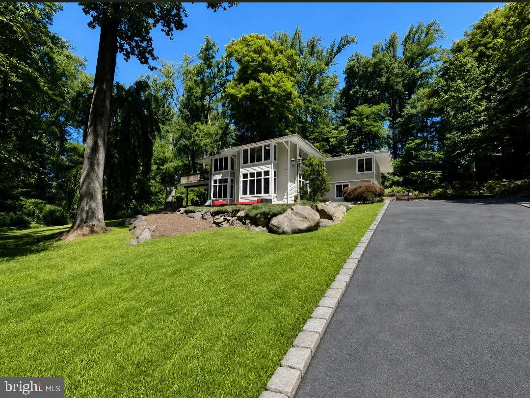 756 Campwoods Road Villanova, PA 19085 - Photo 1 of 38 Modern home embraced by lush greenery.
