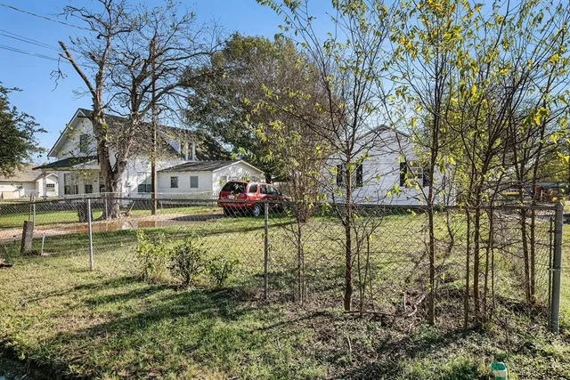 a house view with a garden space