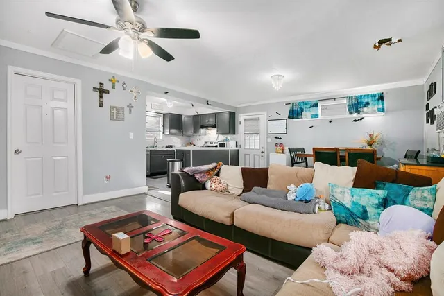 a living room with furniture and a rug