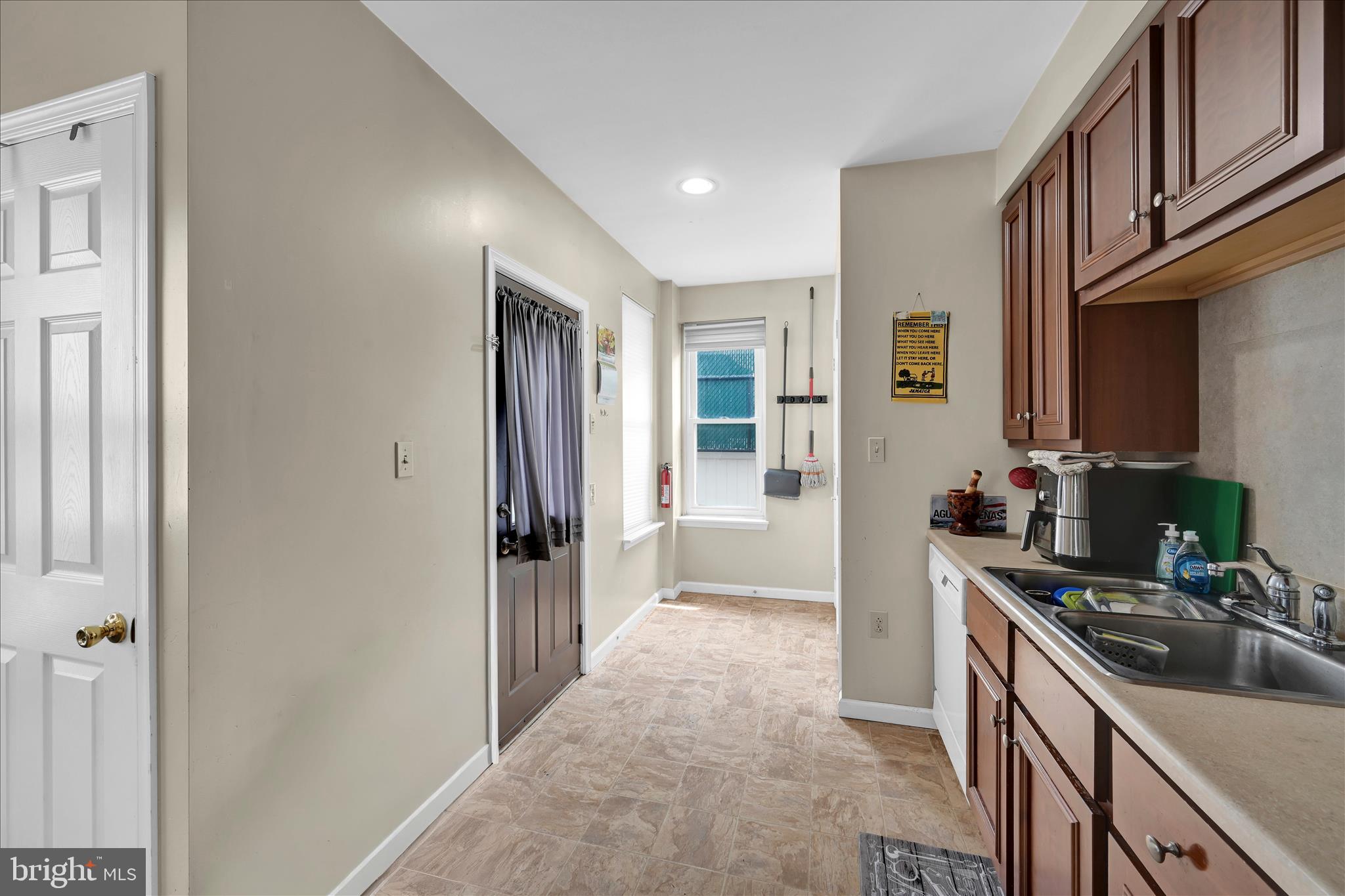 942 Pike Street Reading, PA 19604 - Photo 12 of 27 a kitchen with stainless steel appliances granite countertop a refrigerator and a sink