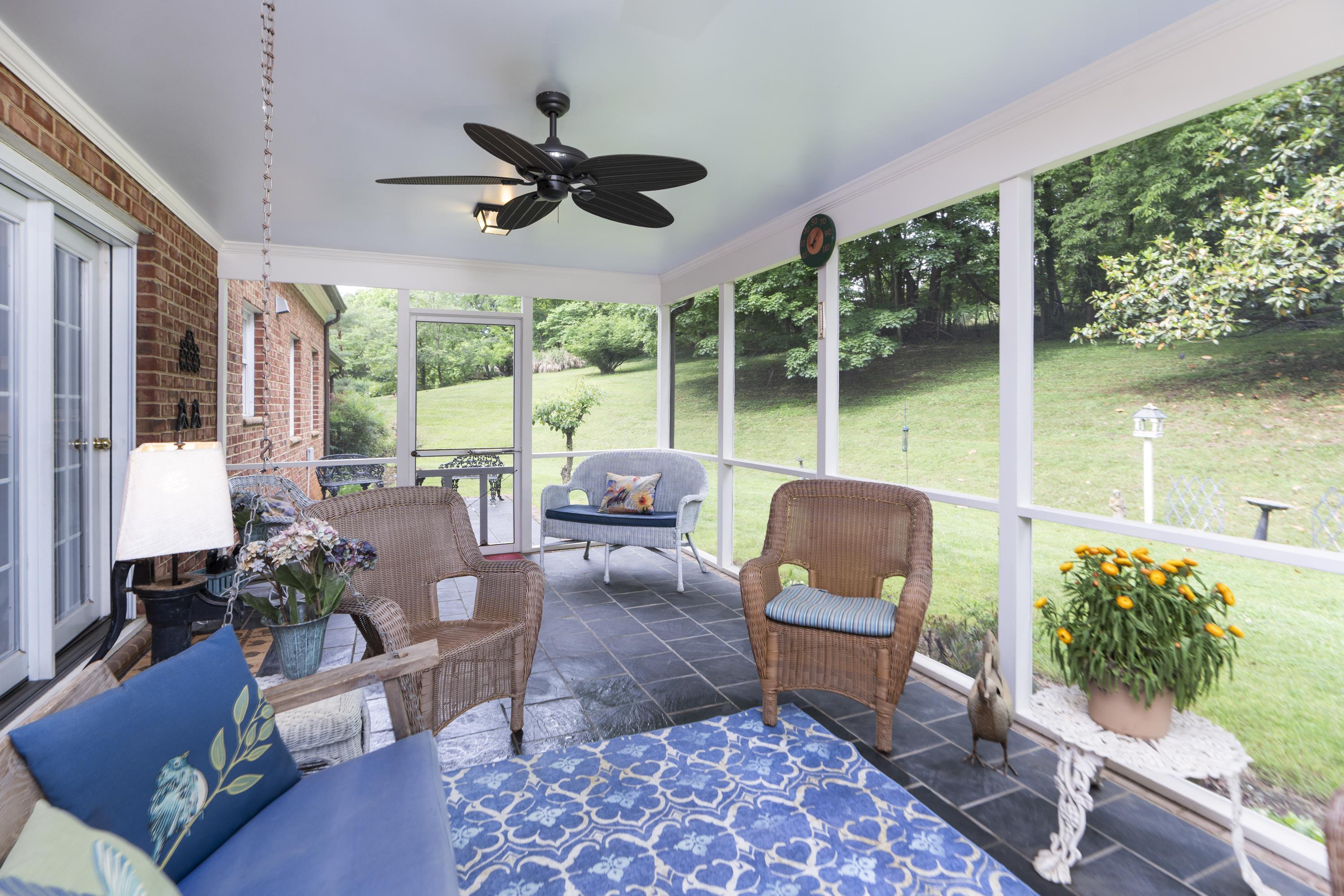 1430 Dogwood Road Staunton, VA 24401 - Photo 31 of 68 a living room with patio furniture and a floor to ceiling window
