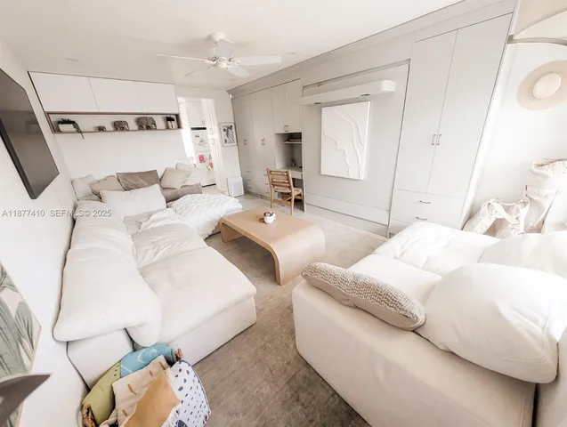 a large white bed in a white room