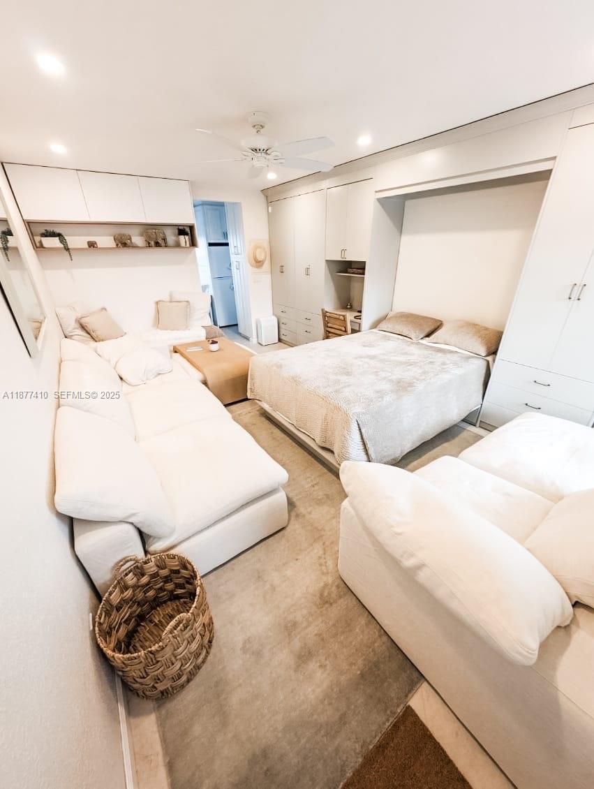 1501 South Surf Road, Unit 21 Hollywood, FL 33019 - Photo 4 of 9 a bedroom with a bed and a painting on the wall