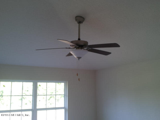 2527 Spring Pond Lane Jacksonville, FL 32221 - Photo 6 of 13 a close up of a wall with a window