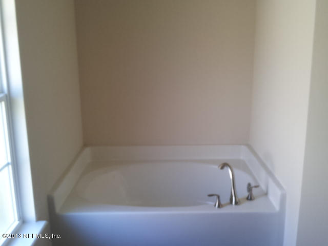 2527 Spring Pond Lane Jacksonville, FL 32221 - Photo 8 of 13 a close up of a bathtub