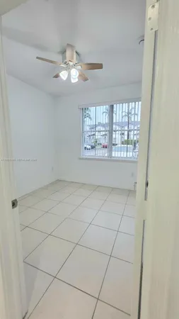a view of an empty room with a bathroom