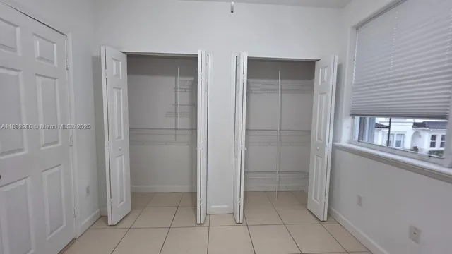 a spacious bathroom with a shower and a sink