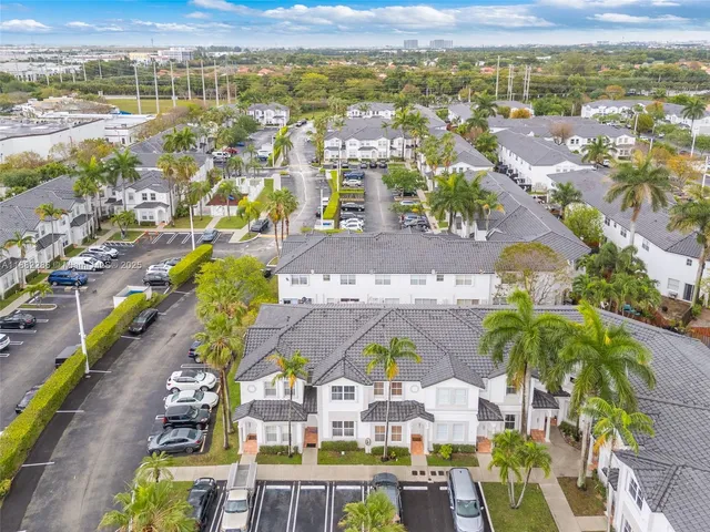 an aerial view of residential building and ocean