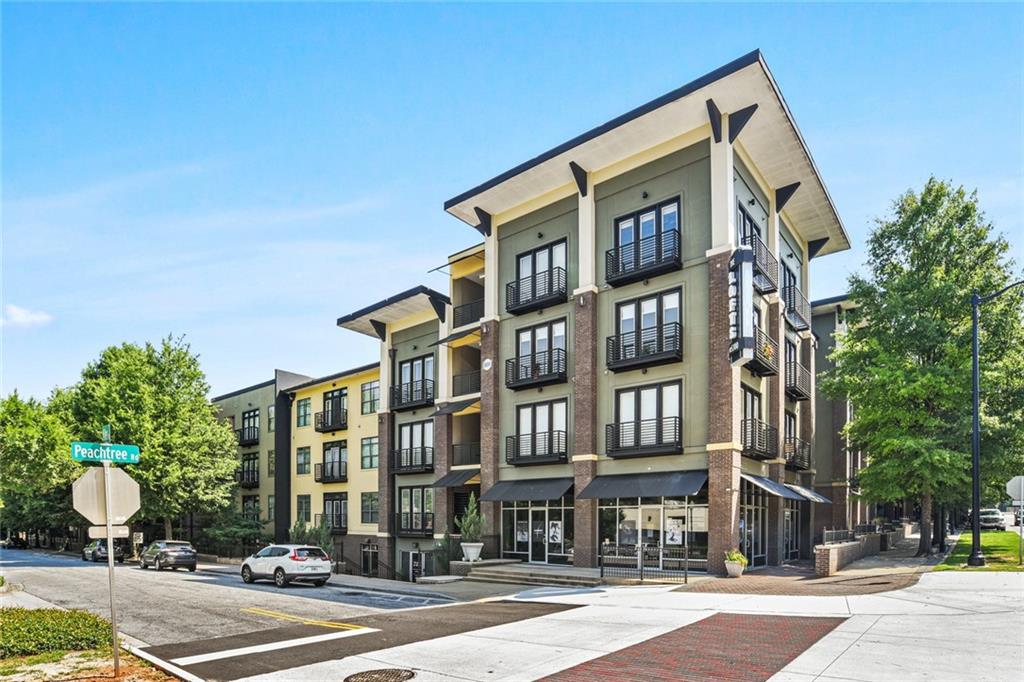 5300 Peachtree Road, Unit 1201 Atlanta, GA 30341 - Photo 1 of 1 a front view of a building and a street