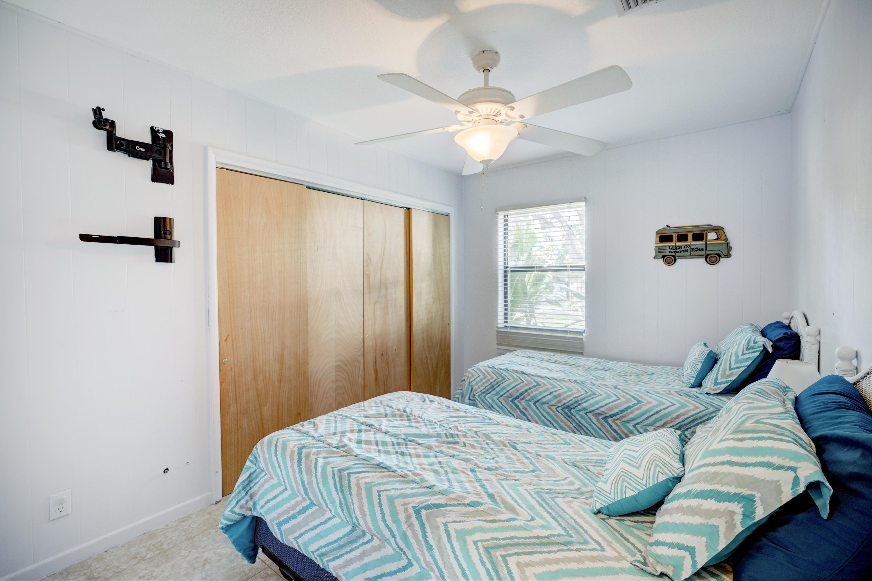 11061 Ellison Wilson Road North Palm Beach, FL 33408 - Photo 12 of 41 a bedroom with a bed and a window