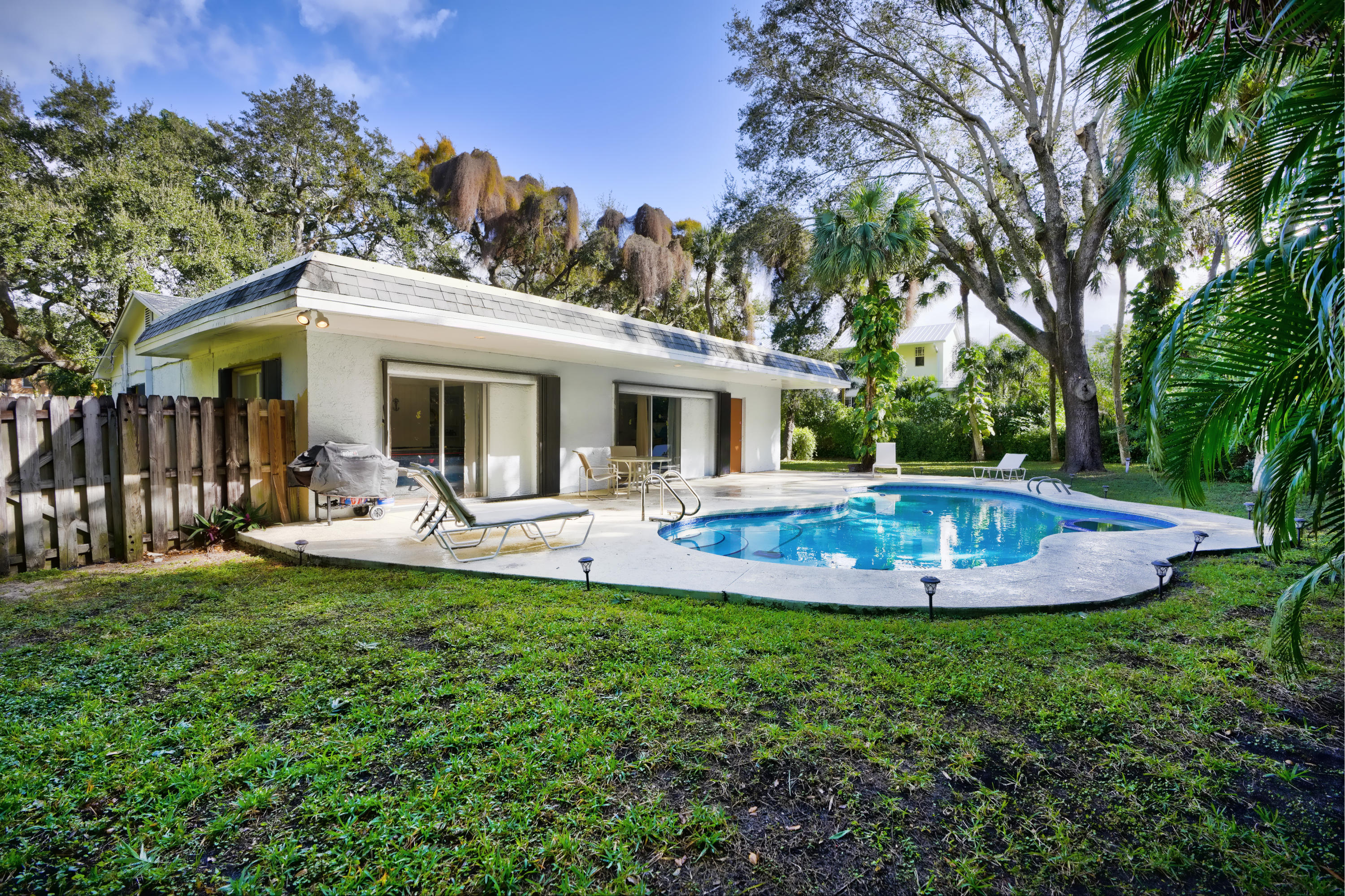 11061 Ellison Wilson Road North Palm Beach, FL 33408 - Photo 30 of 41 a view of a house with backyard porch and furniture