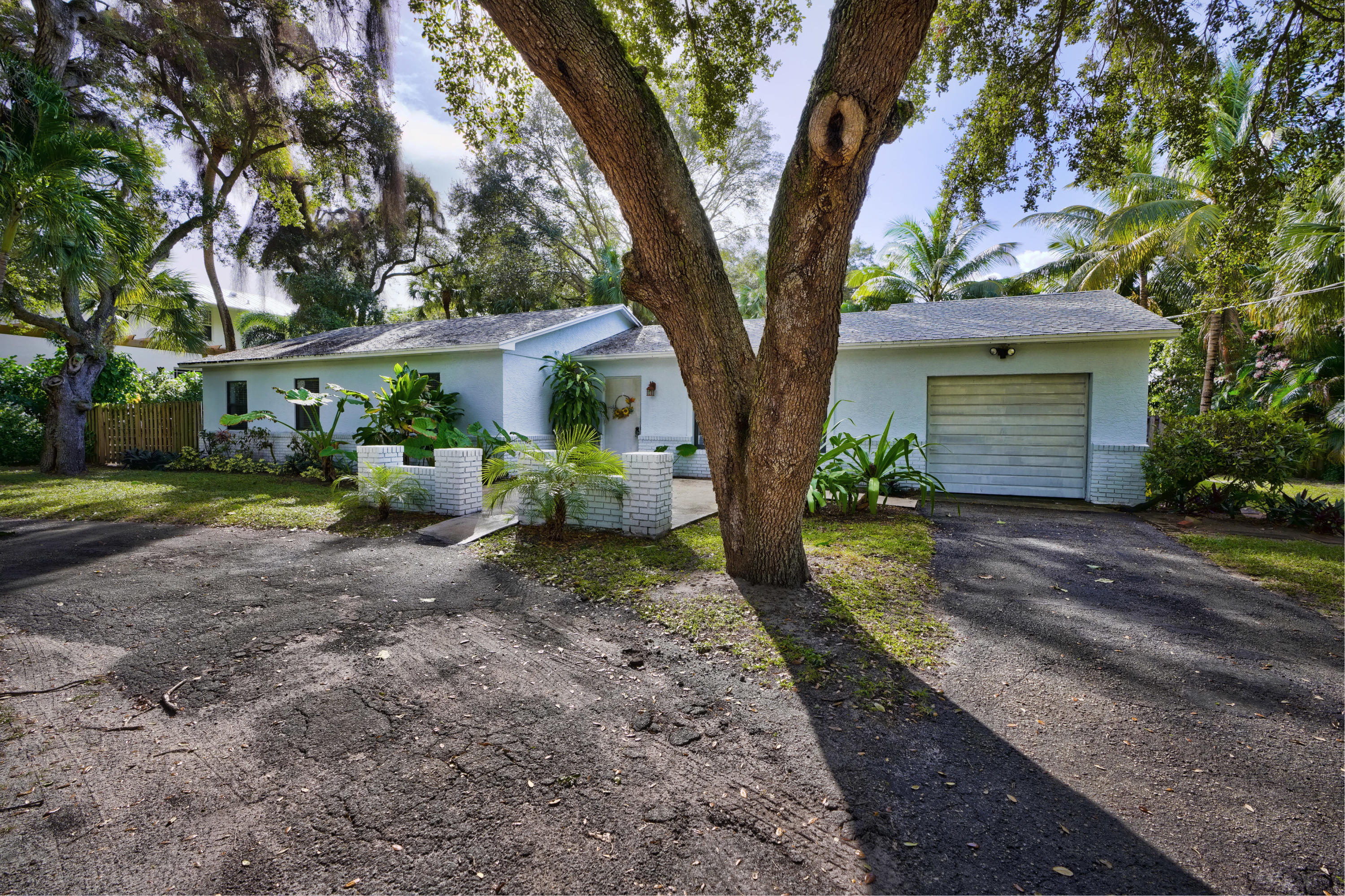 11061 Ellison Wilson Road North Palm Beach, FL 33408 - Photo 3 of 41 a view of a house with backyard and a tree