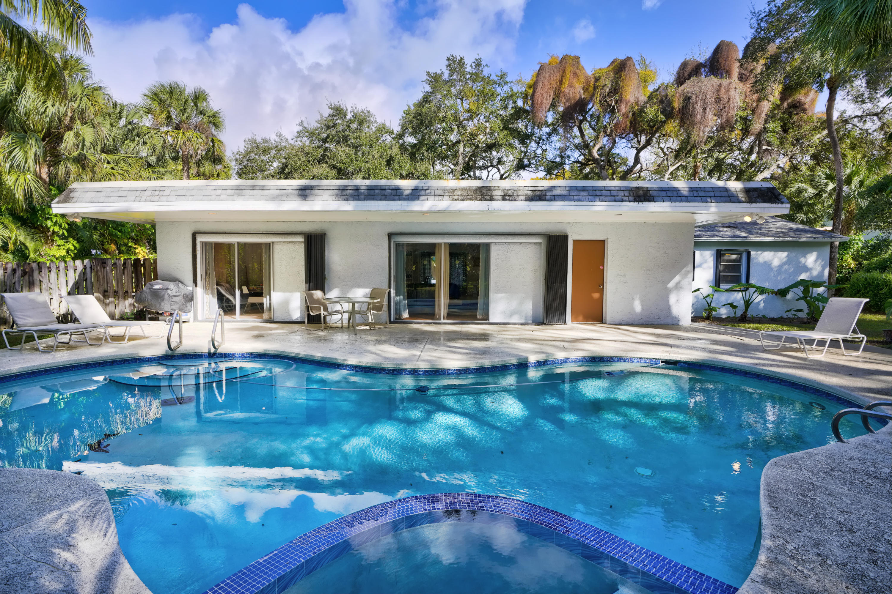 11061 Ellison Wilson Road North Palm Beach, FL 33408 - Photo 32 of 41 a view of a swimming pool with outdoor seating