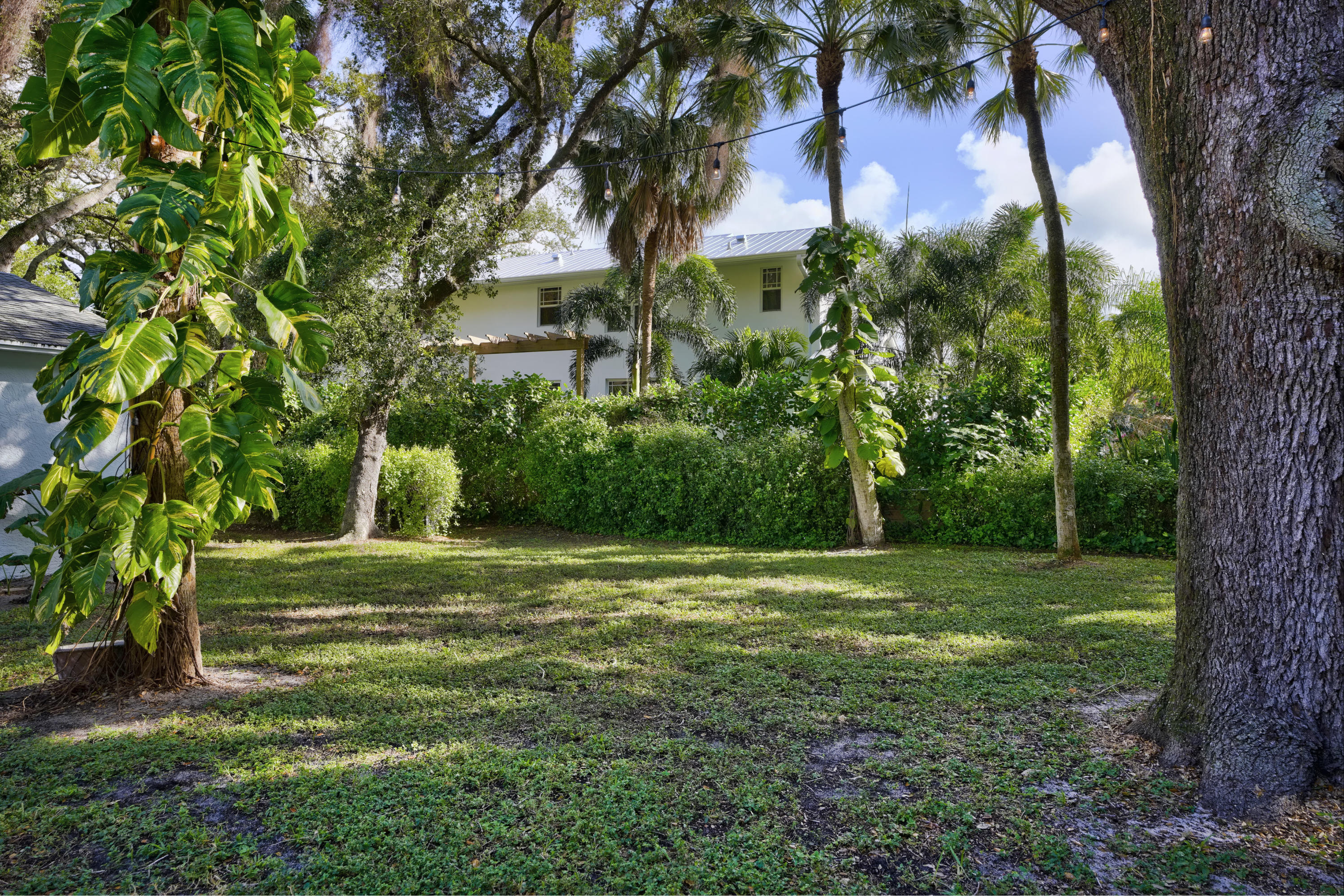 11061 Ellison Wilson Road North Palm Beach, FL 33408 - Photo 35 of 41 a big yard with lots of green space and trees