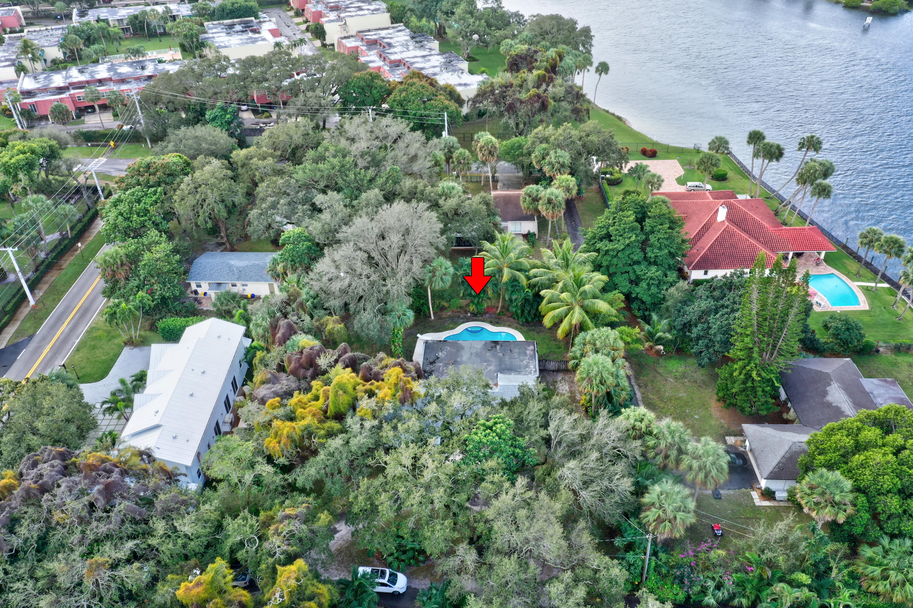 11061 Ellison Wilson Road North Palm Beach, FL 33408 - Photo 40 of 41 an aerial view of a house with a yard and lake view