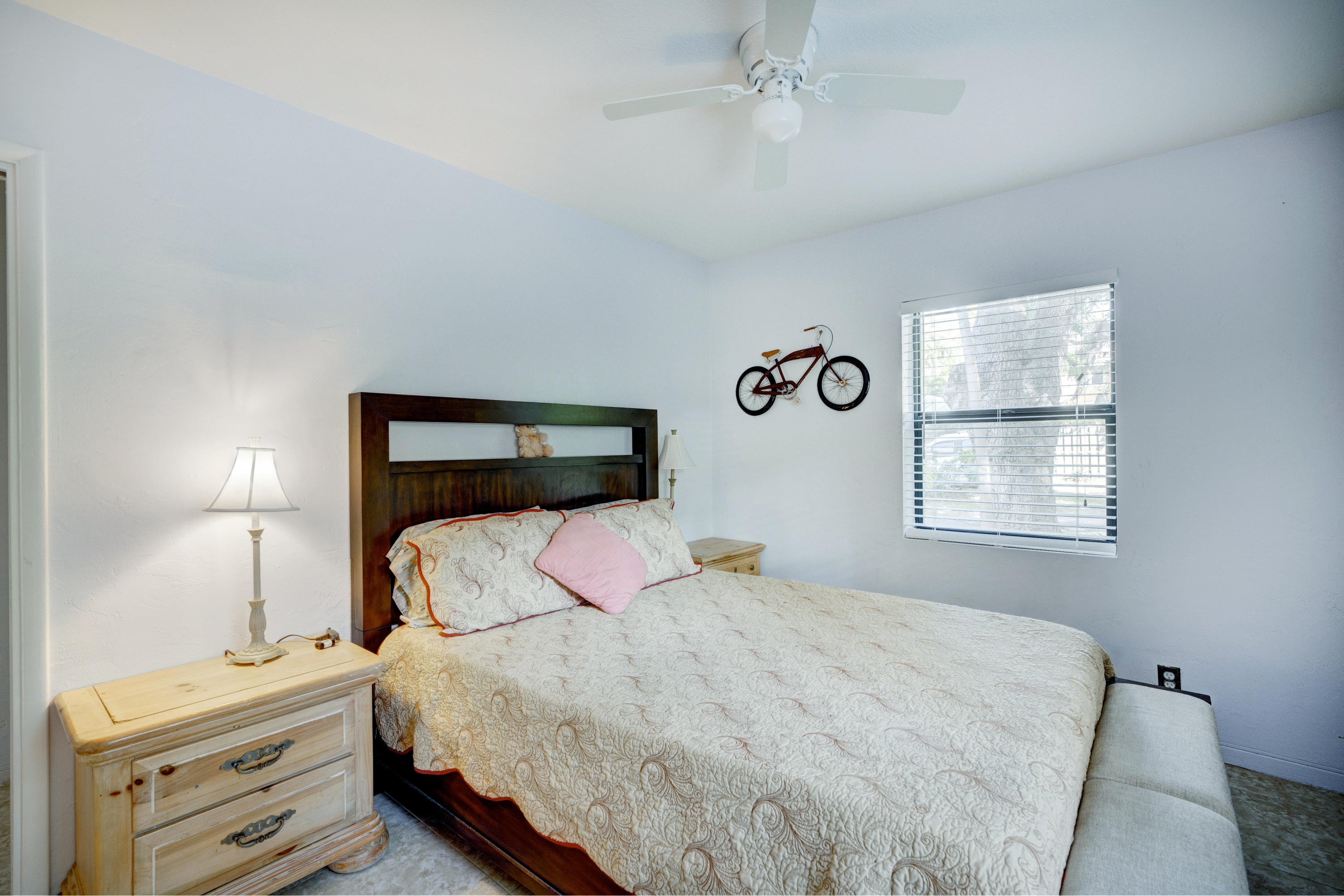 11061 Ellison Wilson Road North Palm Beach, FL 33408 - Photo 10 of 41 a bedroom with a bed and a window