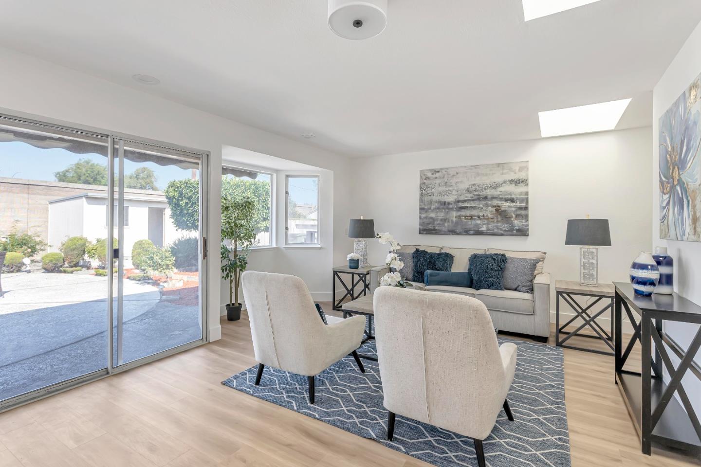 1548 Spring Street Mountain View, CA 94043 - Photo 11 of 40 a living room with furniture large window and wooden floor