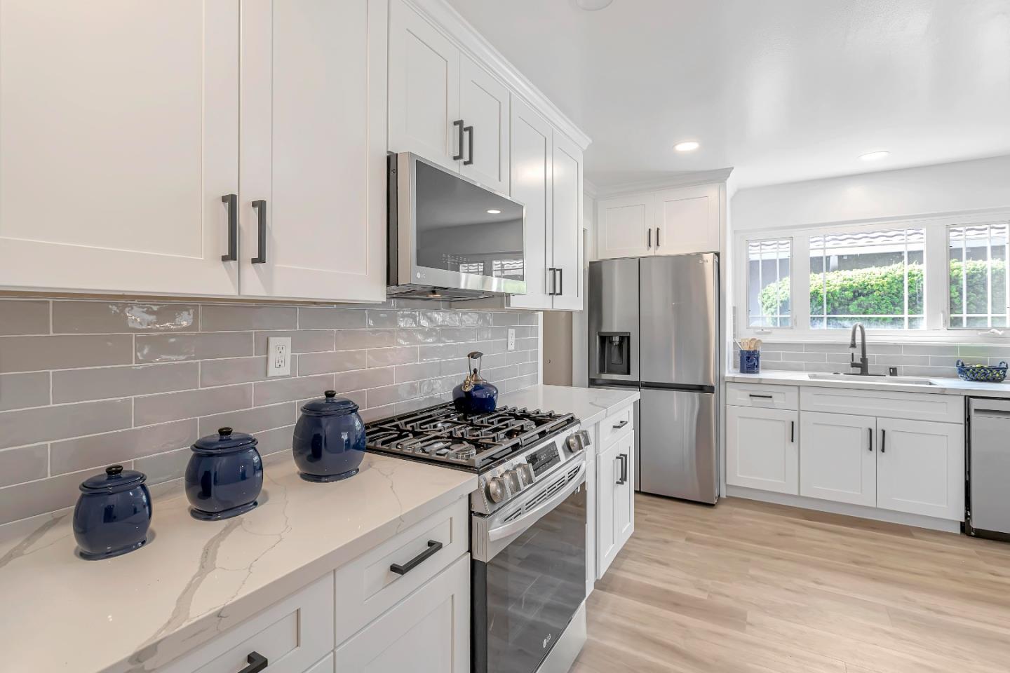 1548 Spring Street Mountain View, CA 94043 - Photo 12 of 40 a kitchen with a sink stove and refrigerator