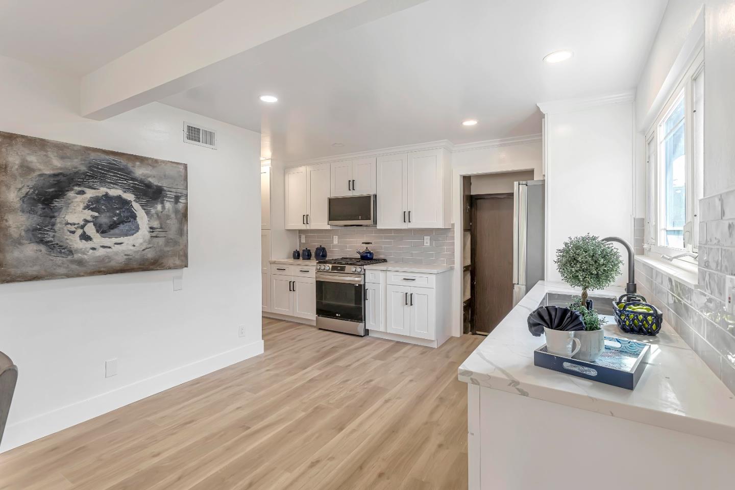 1548 Spring Street Mountain View, CA 94043 - Photo 13 of 40 a kitchen with granite countertop a refrigerator stove and sink