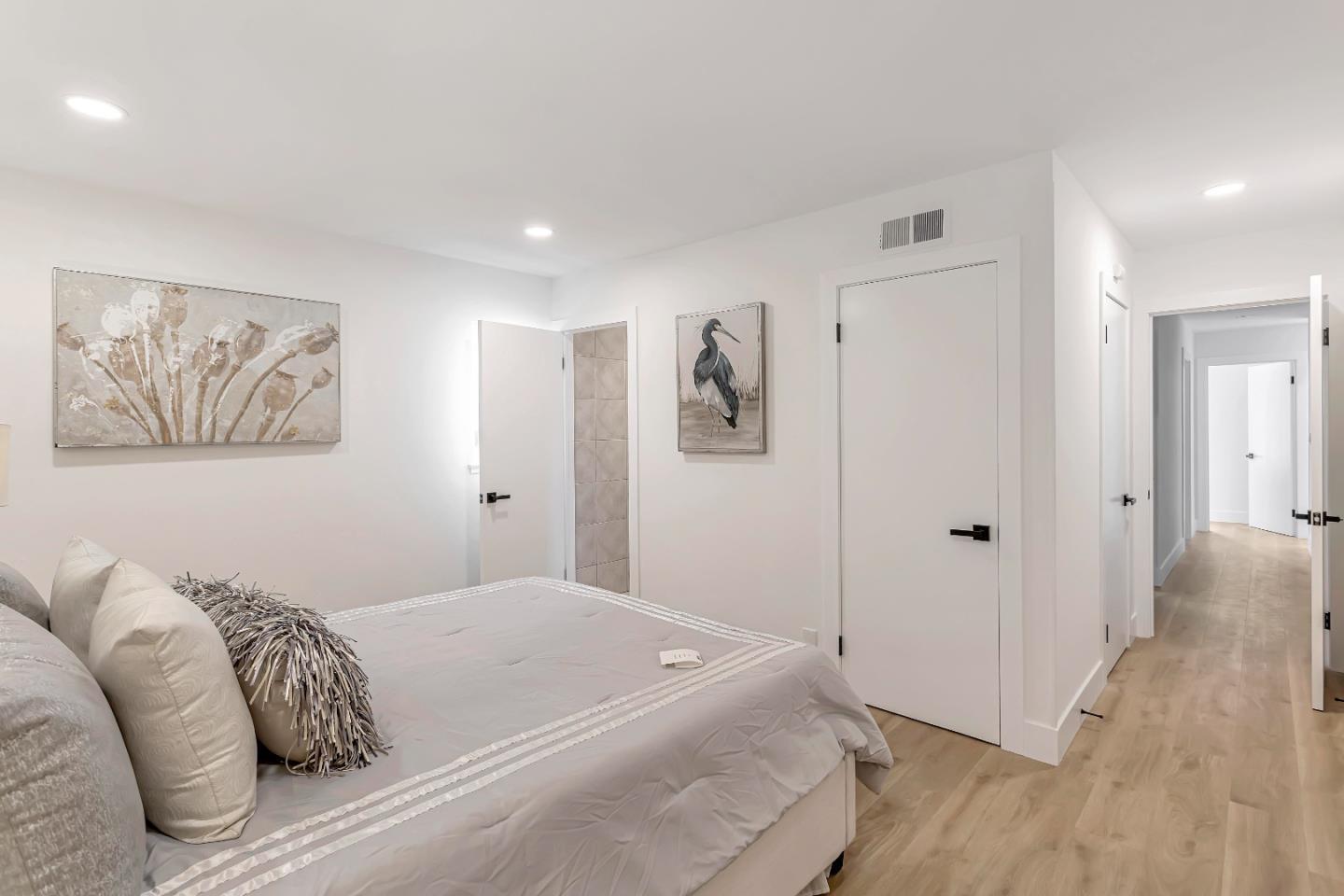 1548 Spring Street Mountain View, CA 94043 - Photo 19 of 40 a bedroom with a bed and a painting on the wall