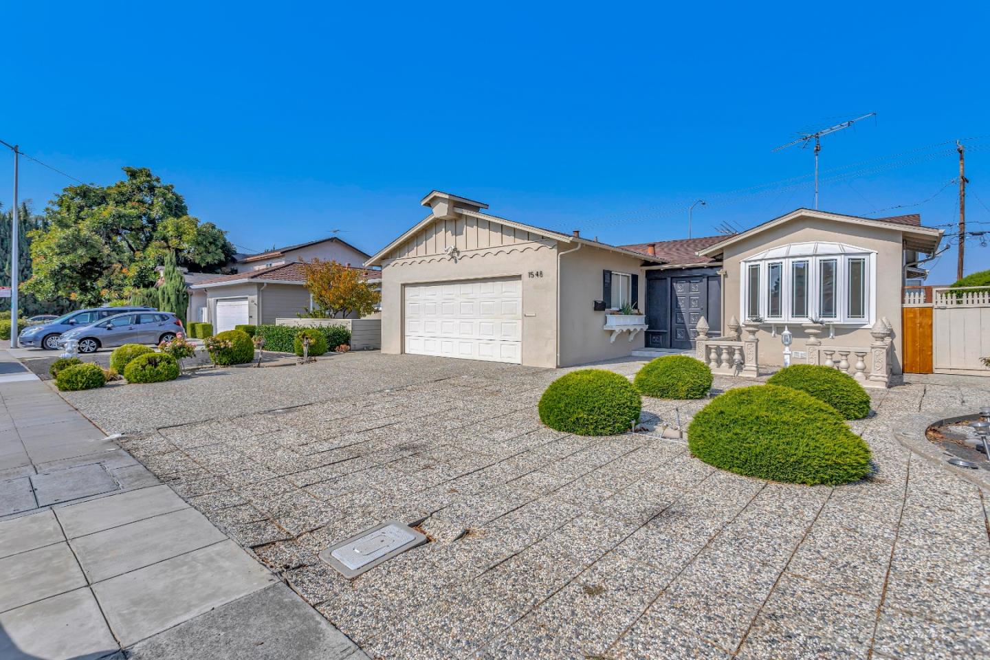 1548 Spring Street Mountain View, CA 94043 - Photo 2 of 40 a front view of a house with garden