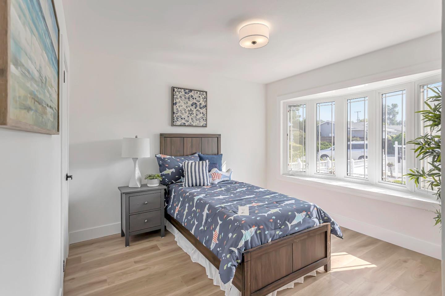 1548 Spring Street Mountain View, CA 94043 - Photo 21 of 40 a bedroom with a bed and large windows