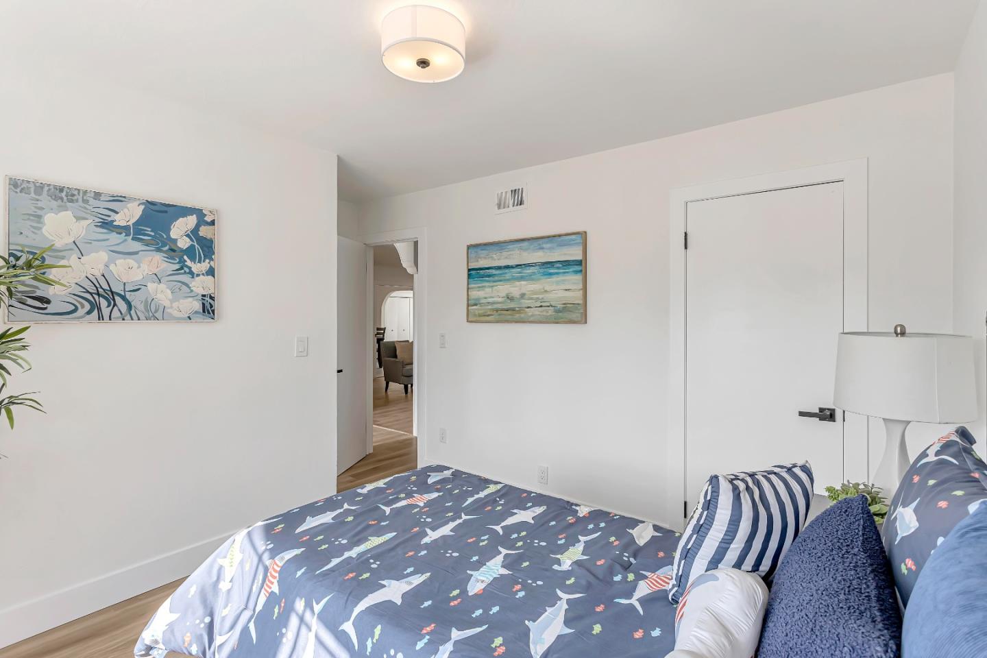 1548 Spring Street Mountain View, CA 94043 - Photo 22 of 40 a bedroom with a bed and a painting on the wall