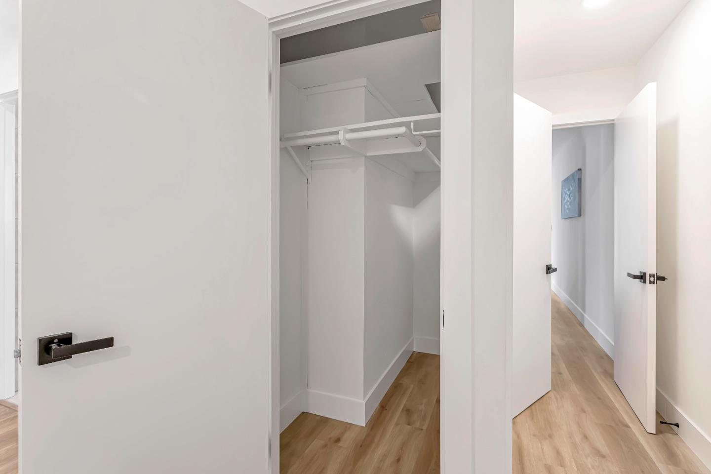 1548 Spring Street Mountain View, CA 94043 - Photo 25 of 40 a view of a hallway with closet and wooden floor