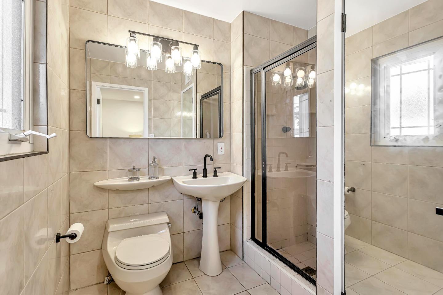 1548 Spring Street Mountain View, CA 94043 - Photo 26 of 40 a bathroom with a sink toilet and shower