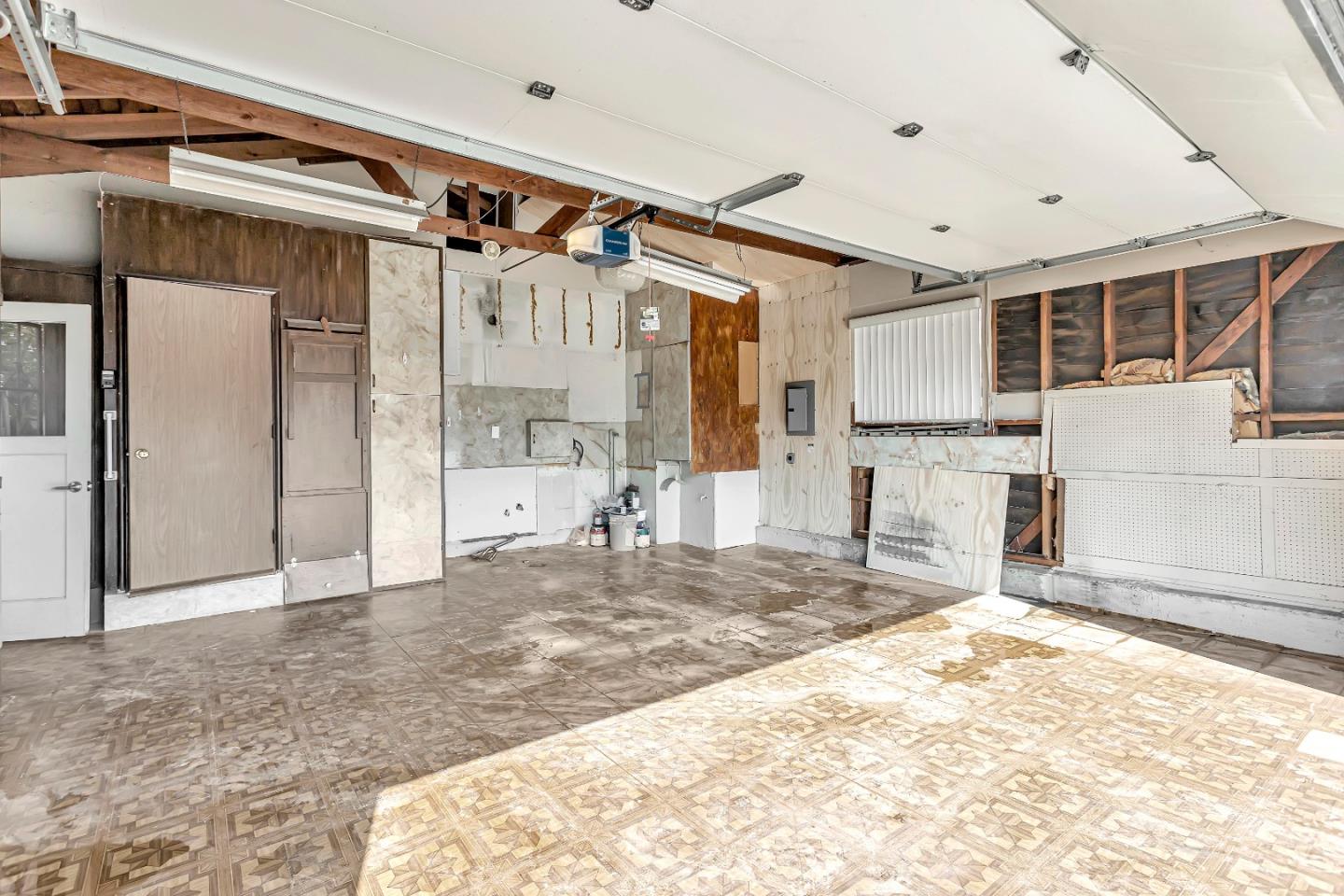 1548 Spring Street Mountain View, CA 94043 - Photo 29 of 40 a view of a livingroom with wooden floor and a ceiling fan