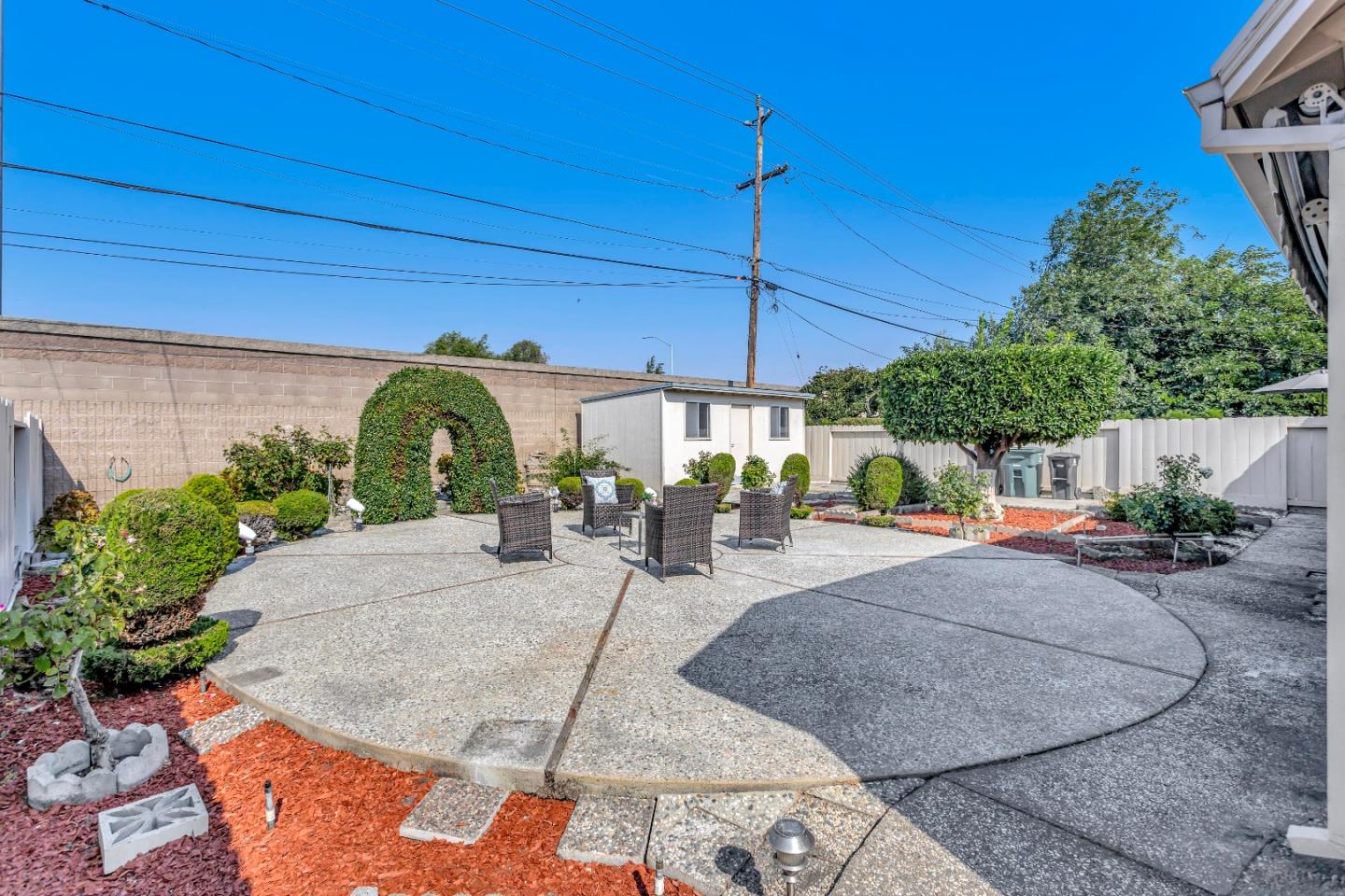 1548 Spring Street Mountain View, CA 94043 - Photo 33 of 40 a view of a patio with a table and chairs under an umbrella