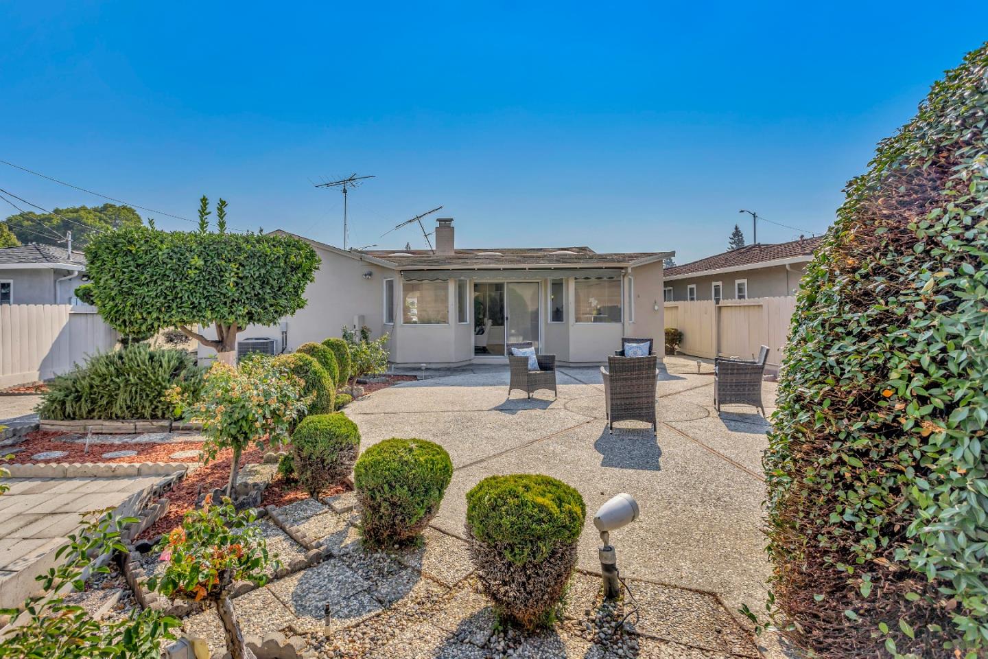 1548 Spring Street Mountain View, CA 94043 - Photo 34 of 40 a view of a patio with couches table and chairs and potted plants