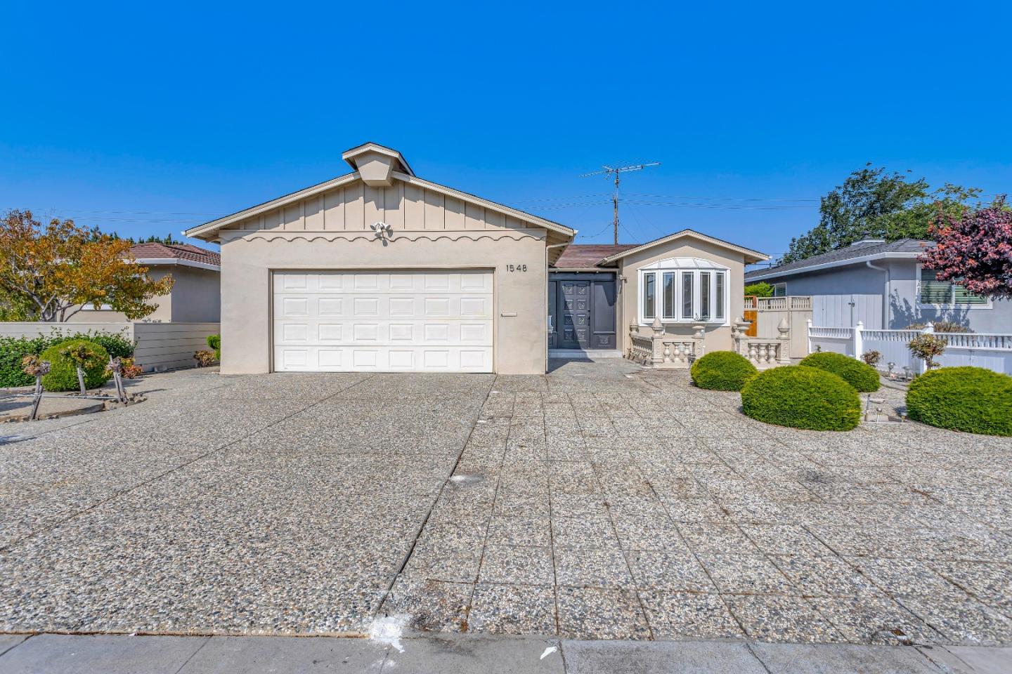 1548 Spring Street Mountain View, CA 94043 - Photo 37 of 40 a front view of a house with a yard and garage