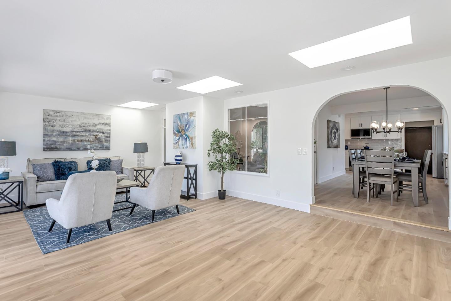 1548 Spring Street Mountain View, CA 94043 - Photo 8 of 40 a living room with furniture a dining table and a large window