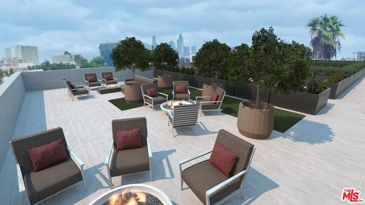 2847 Leeward Avenue, Unit 607 Los Angeles, CA 90005 - Photo 12 of 14 a view of a chairs and table in the terrace