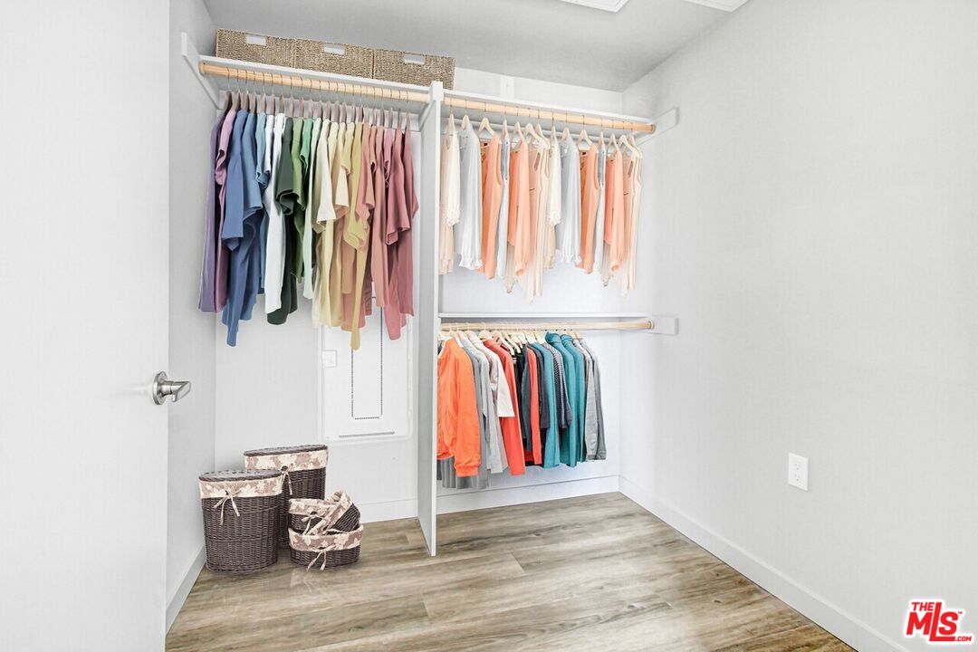 2847 Leeward Avenue, Unit 607 Los Angeles, CA 90005 - Photo 10 of 14 a view of walk in closet with clothes and shoes